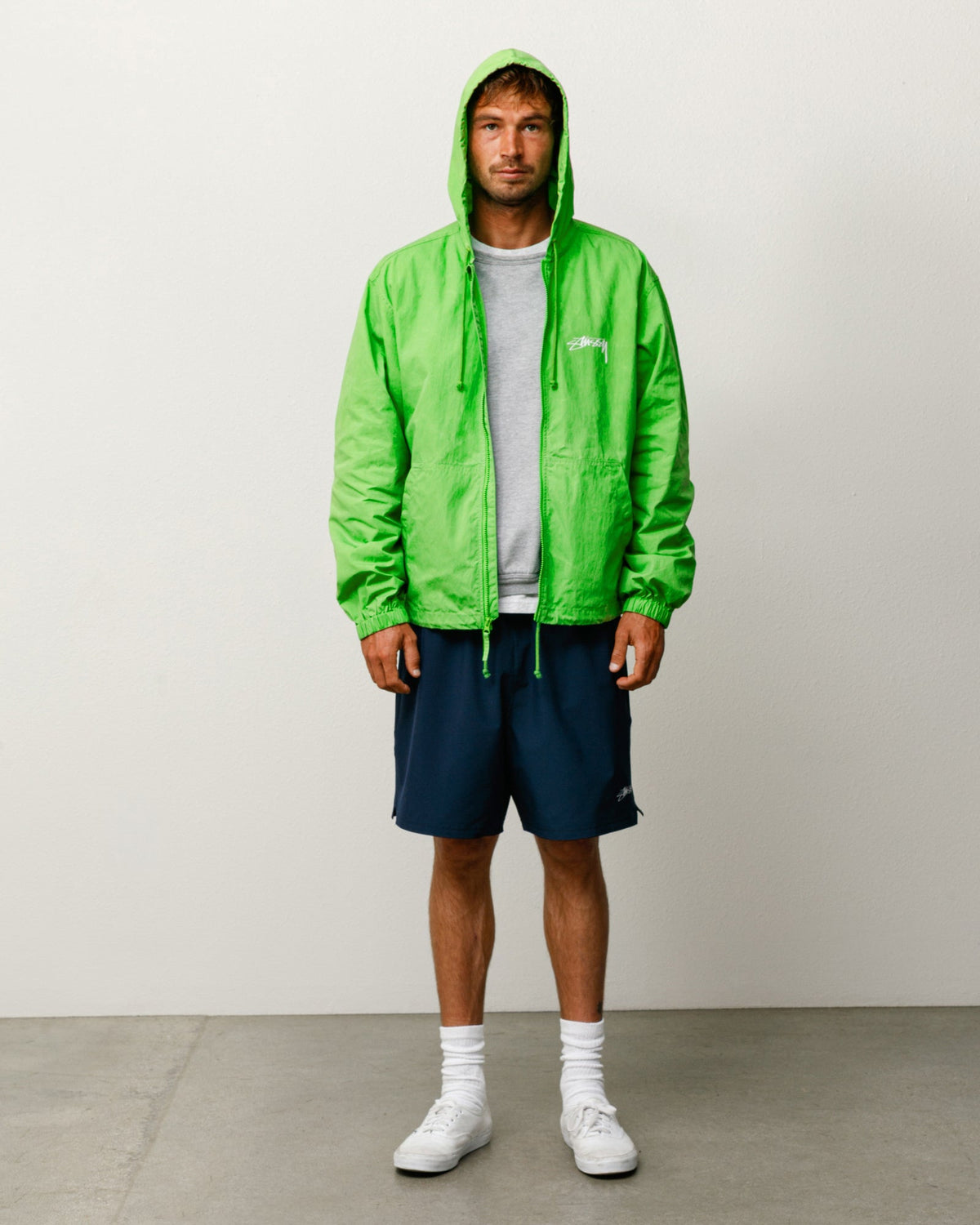 Stüssy Waxed Cotton Beach Shell jacket in Kiwi green with hood and chest logo