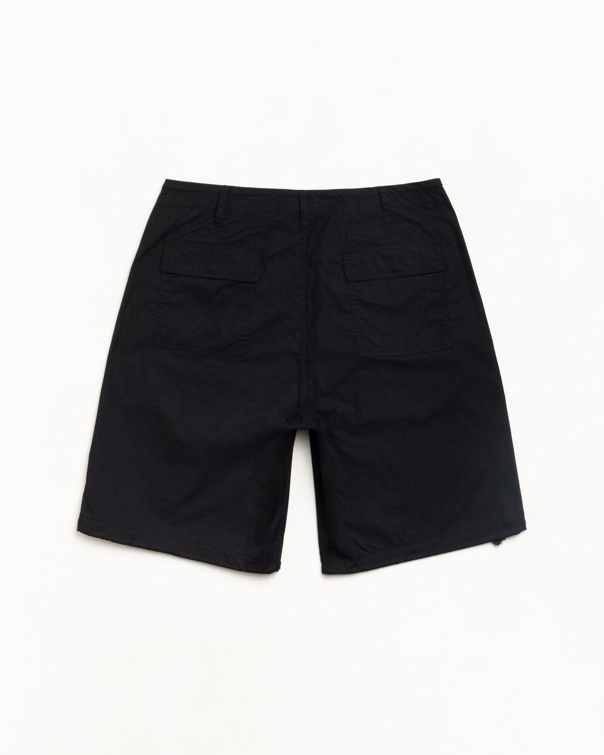 Surplus Short in Black, back view with dual flap pockets; flat lay on white