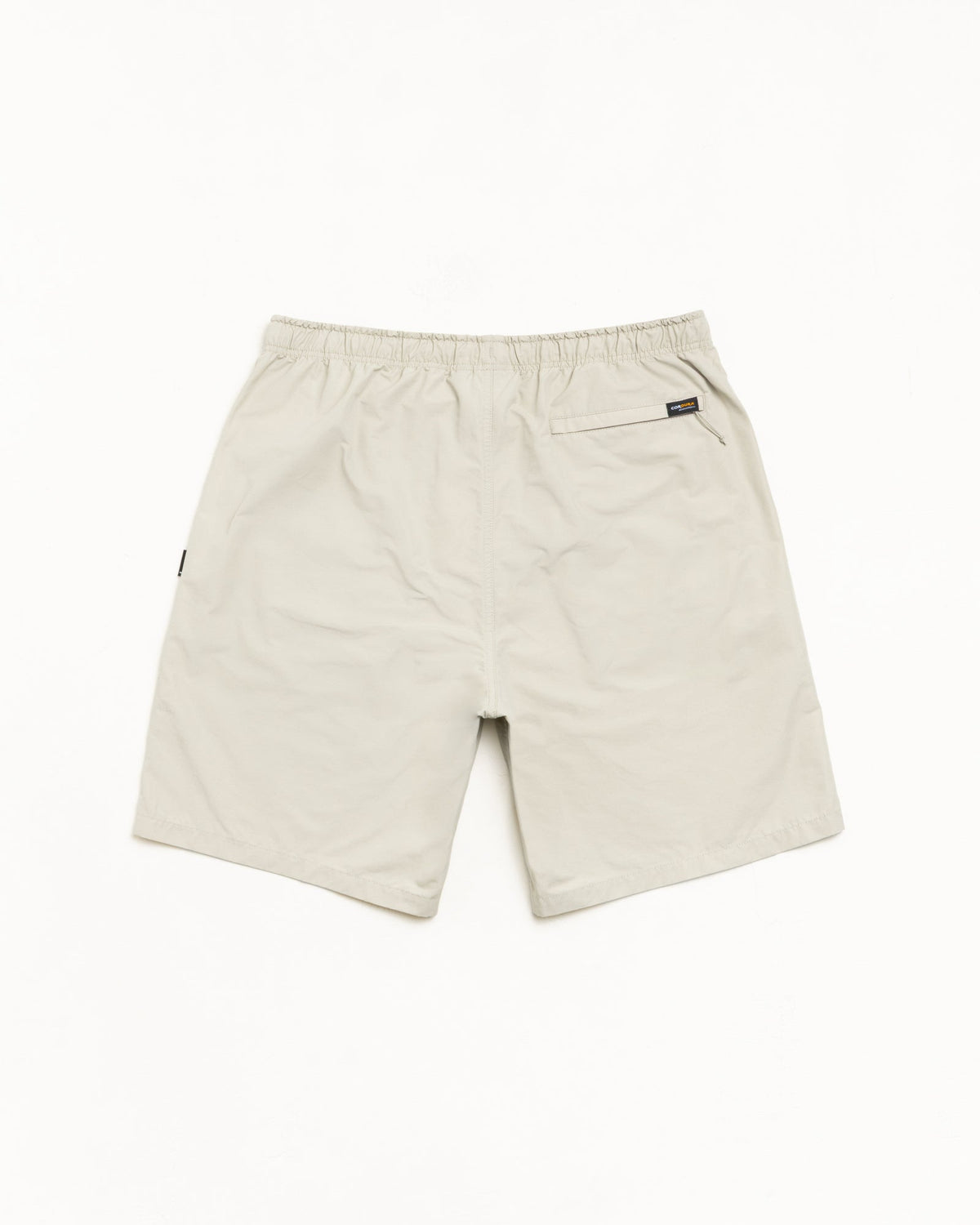 Transit Short unisex shorts in Sand with elastic waist and rear zip pocket, nylon-cotton blend.