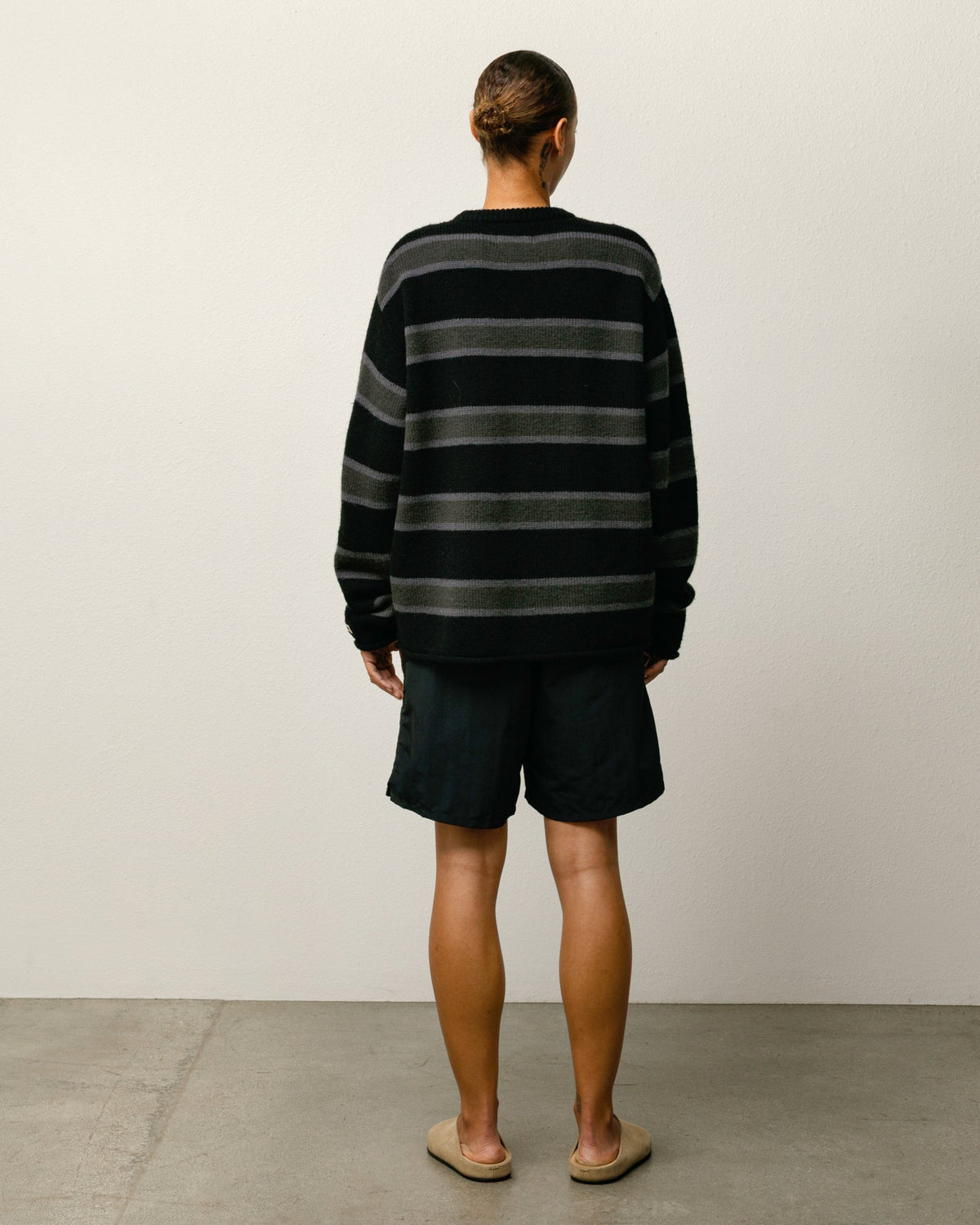 Stock Water Short shorts in black nylon with elastic waist and Stüssy logo at left leg
