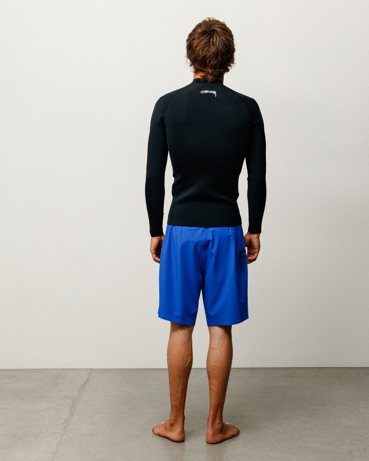 Peak Board Short bottoms in blue stretch nylon with side zip pocket, unisex fit.