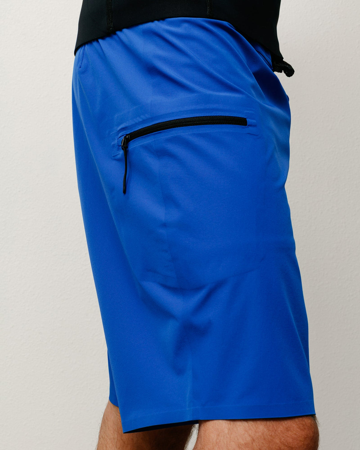 Peak Board Short shorts in Blue, stretch nylon with side zip pocket; unisex fit