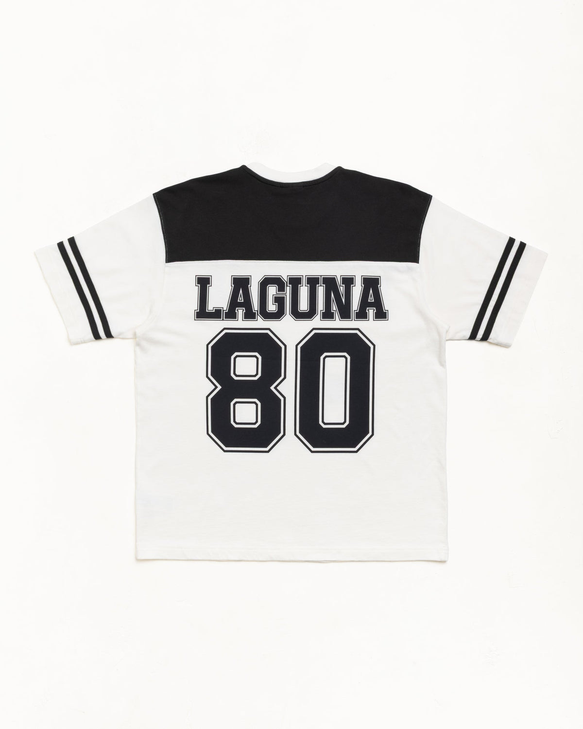 Stüssy Laguna 80 Jersey in the color Black, back view with bold Laguna 80 graphic and striped sleeves.