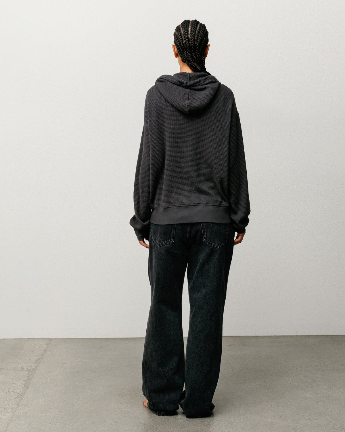 Lightweight Thermal Hoodie Zip Hood in the color Faded Black, back view on model