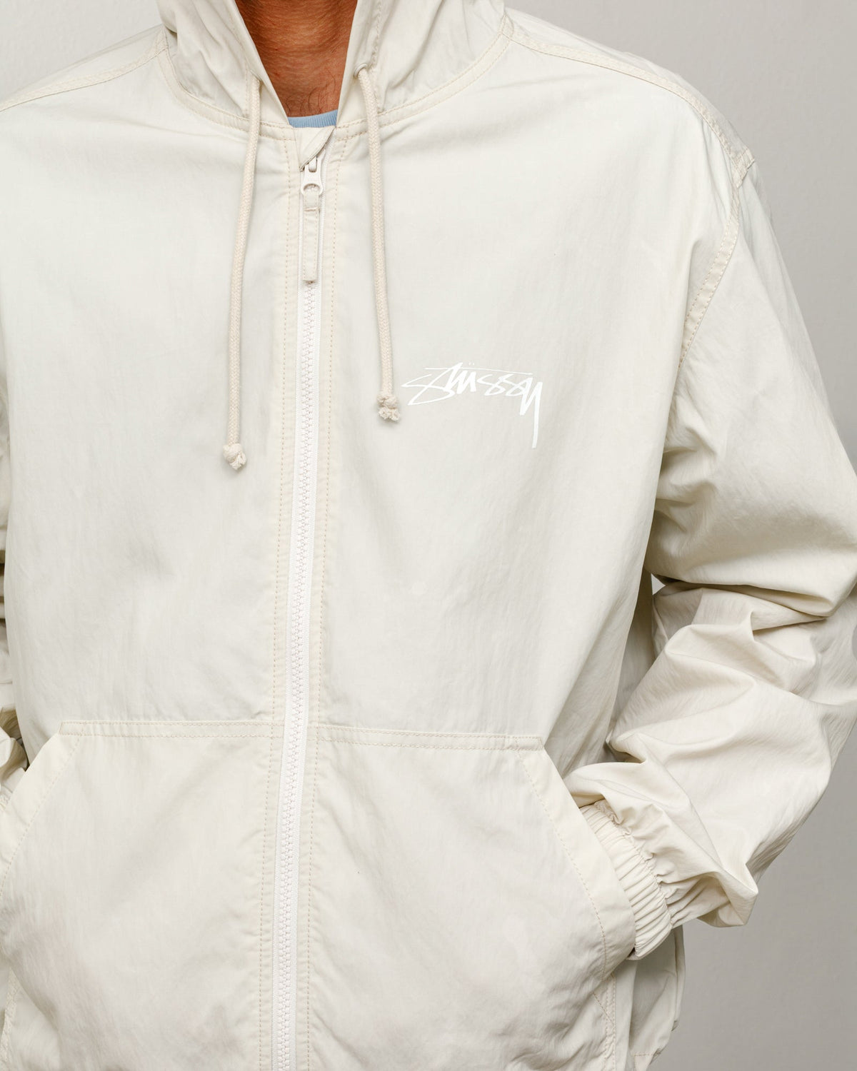 Stüssy Waxed Cotton Beach Shell jacket in the Stone color