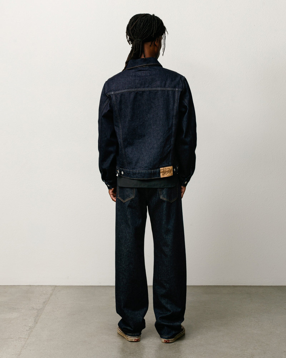 Denim Trucker Jacket in Rinsed Indigo, relaxed boxy fit with suede Stüssy patch