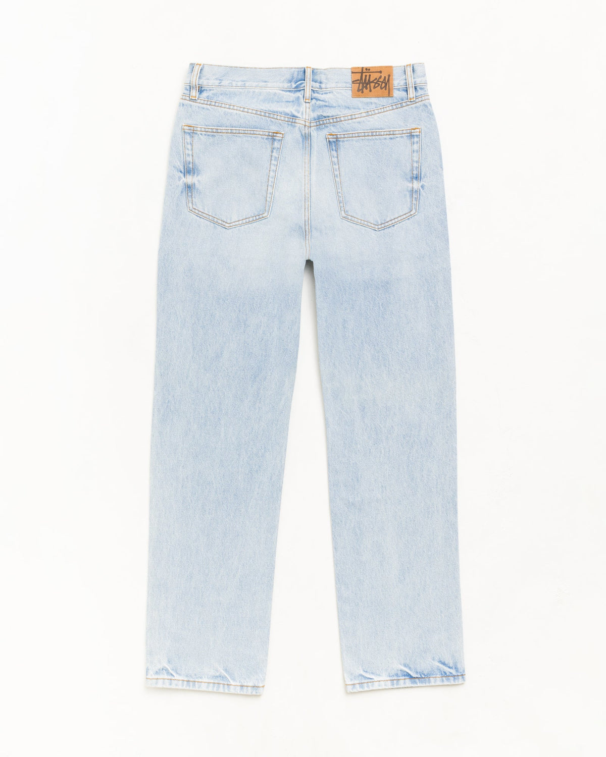 Slim Jean Denim in Light Wash Indigo with back pockets and Stüssy logo patch.