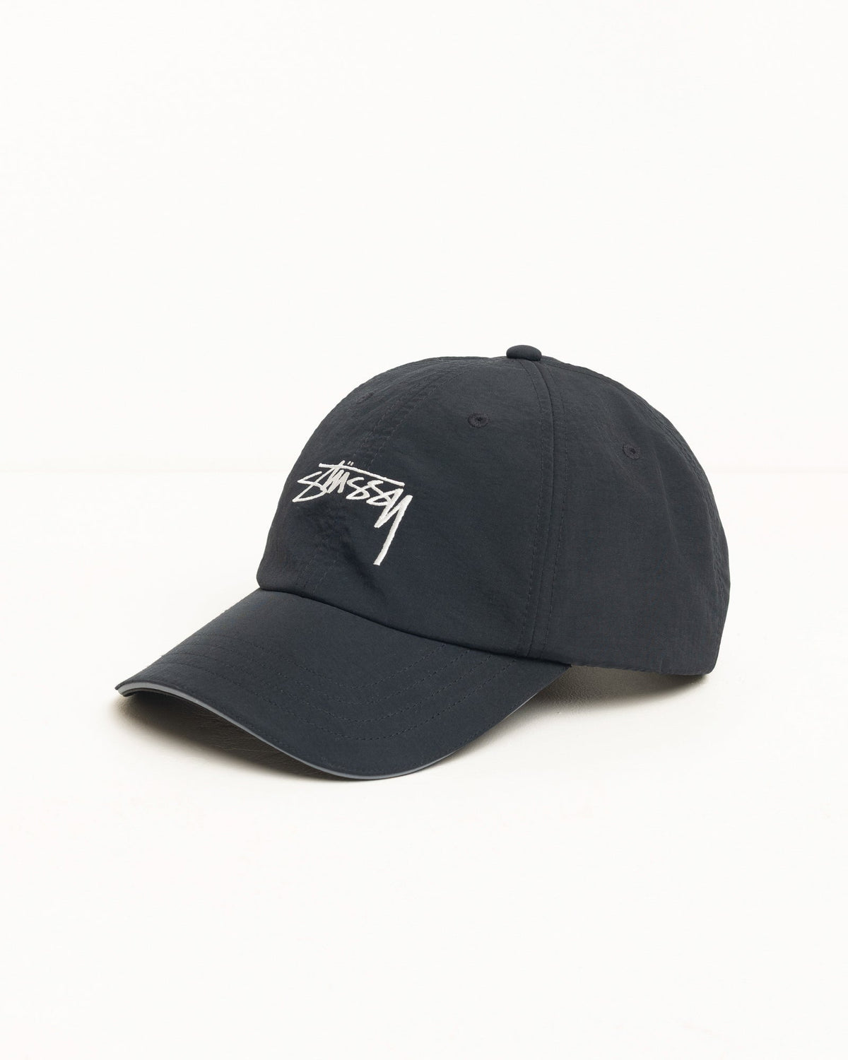 Stüssy Smooth Stock Nylon Sport Cap in black with white logo embroidery