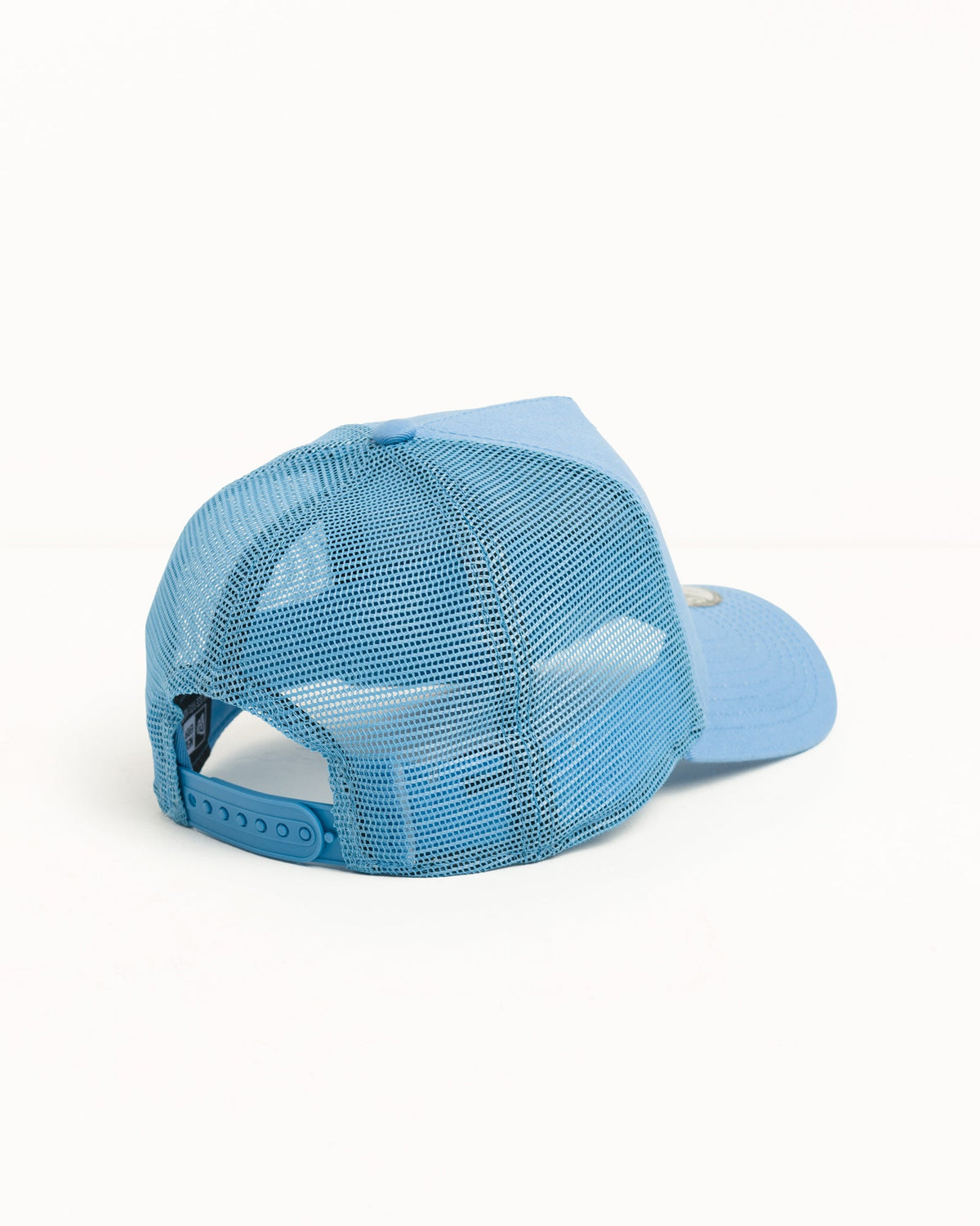 Stüssy 9FORTY Sport Trucker headwear in Sky Blue, cotton twill front and mesh back with snapback