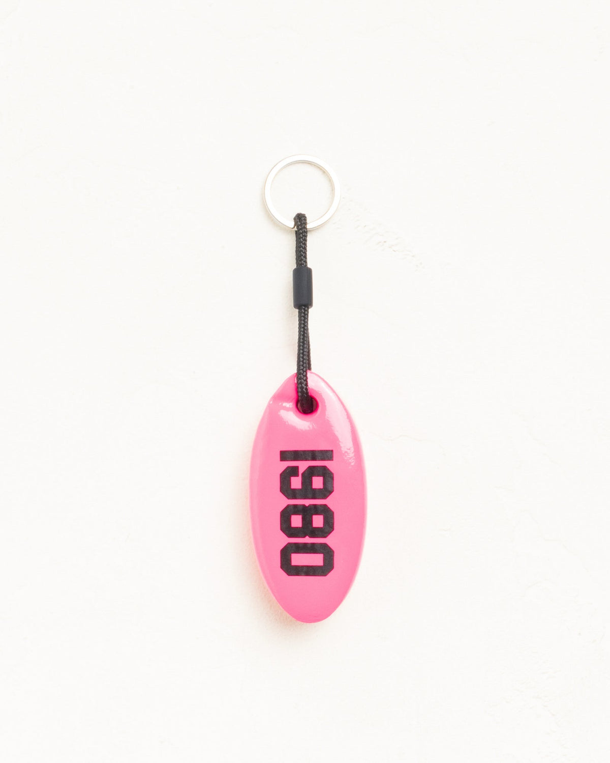 Floatie Keychain in pink vinyl-coated foam with Stüssy logo and 1980 print